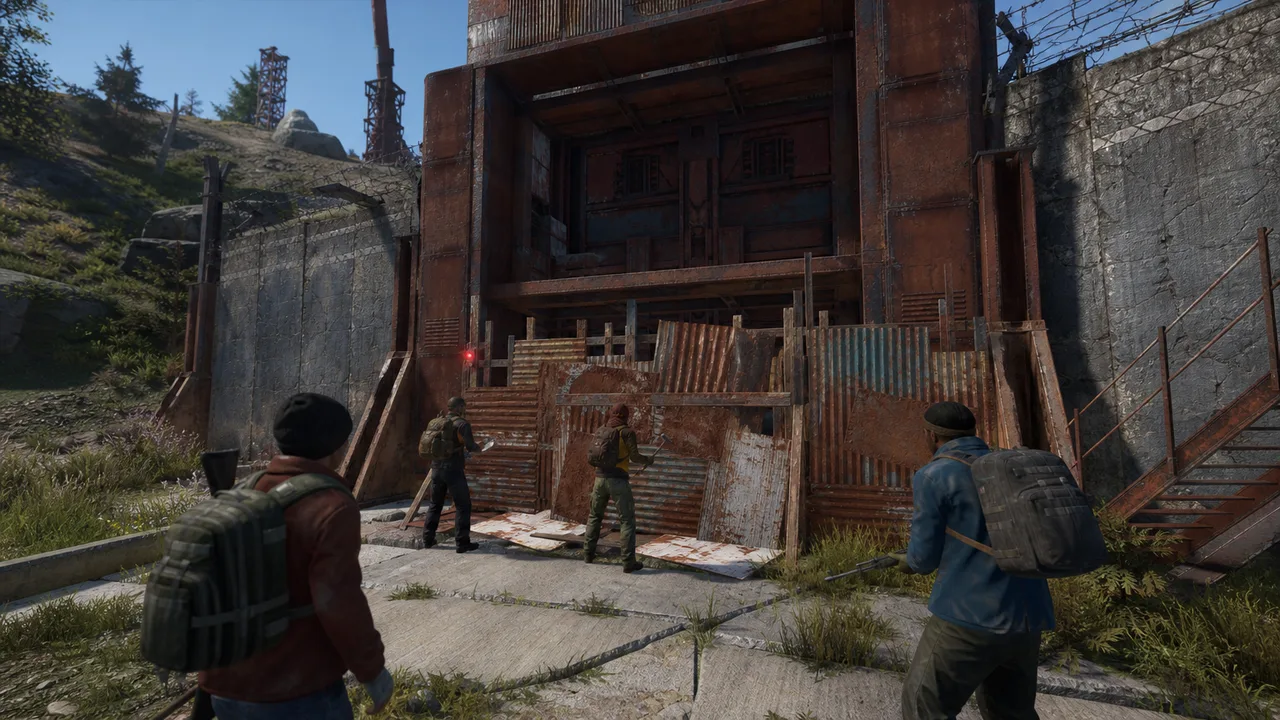 Survivors confront a breakable blocker at a red-keycard monument