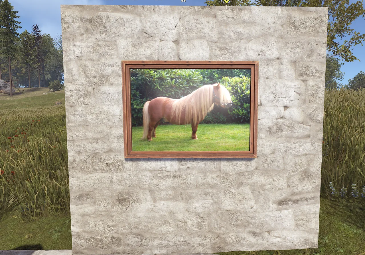 Rust stone wall displaying a framed pony image outdoors, demonstrating Sign Artist with /sil.