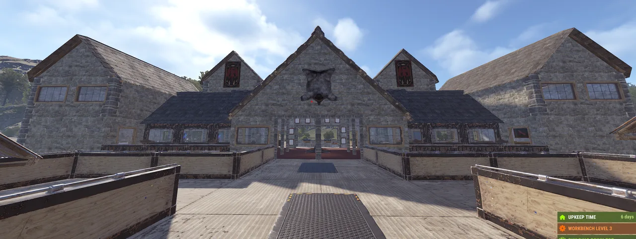 Rust town with stone buildings; HUD text: UPKEEP TIME 6 days, WORKBENCH LEVEL 3.