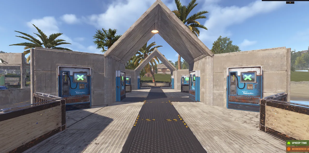 Rust town entrance with vending machines labeled RustAddicted; UPKEEP TIME and WORKBENCH LEVEL 3 visible.